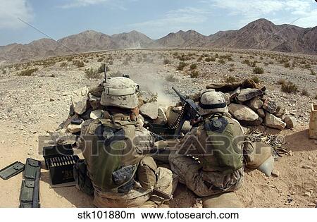 A marine fires his M2. 50 caliber heavy machine gun. View Large Photo Image Picture - A marine fires his M2. 50 caliber heavy machine gun.. Fotosearch