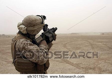 A Marine fires the M-32 Multiple shot Grenade Launcher. View Large Photo Image Picture - A Marine fires the M-32 Multiple shot Grenade Launcher.. Fotosearch