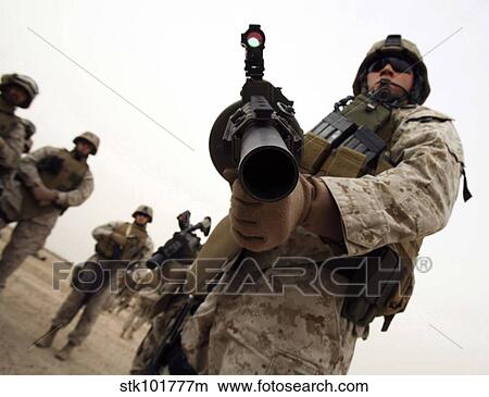 A marine holds the M-32 Multiple shot Grenade Launcher. View Large Photo Image Picture - A marine holds the M-32 Multiple shot Grenade Launcher.. Fotosearch