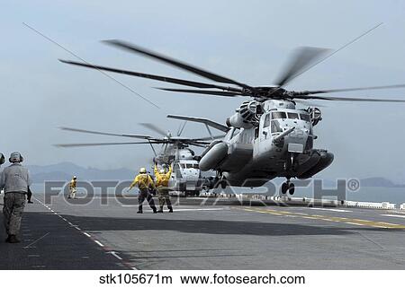 A Marine MH-53 helicopter takes off from the flight deck of USS Essex. View Large Photo Image Picture - A Marine MH-53 helicopter takes off from the flight deck of USS Essex.. Fotosearch