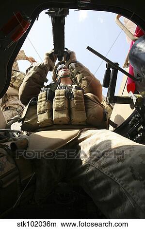 A marine rocks his M-2. 50-caliber machine gun. View Large Photo Image Picture - A marine rocks his M-2. 50-caliber machine gun.. Fotosearch