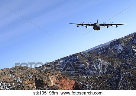 A MC-130J Combat Shadow II aircraft flies over New Mexico. View Large Photo Image Picture - A MC-130J Combat Shadow II aircraft flies over New Mexico.. Fotosearch