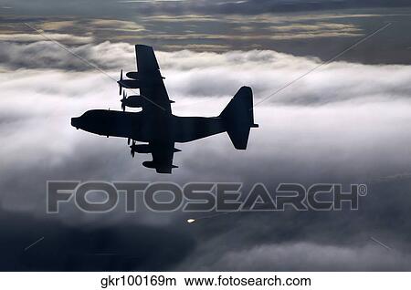 A MC-130P Combat Shadow dropping a flare. View Large Photo Image Picture - A MC-130P Combat Shadow dropping a flare.. Fotosearch