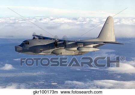 A MC-130P Combat Shadow soars above the clouds. View Large Photo Image Picture - A MC-130P Combat Shadow soars above the clouds.. Fotosearch
