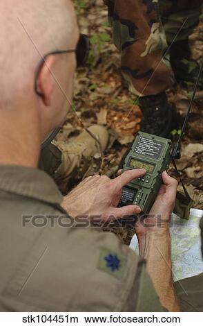 Picture - A member of the 130th Airlift Wing practices using a GPS location device.. Fotosearch
