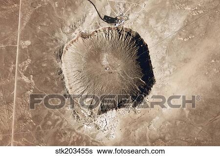 Stock Photograph - A meteorite impact crater in the northern Arizona desert of the United States.. Fotosearch