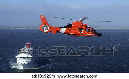 Picture - A MH-65C Dolphin helicopter off the coast of San Pedro, California.. Fotosearch