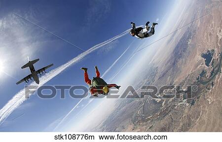 Picture - A military freefall parachutist course student conducts a HALO jump.. Fotosearch