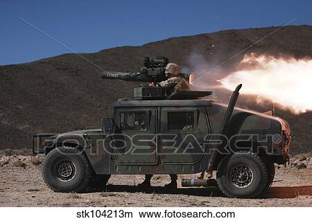 A missileman firing a BGM-71 TOW missile atop a humvee. View Large Photo Image Picture - A missileman firing a BGM-71 TOW missile atop a humvee.. Fotosearch