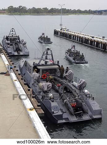 A MK-V Special Operations Craft tied pierside manned and loaded with combat rubber raiding craft View Large Photo Image Picture - A MK-V Special Operations Craft tied pierside manned and loaded with combat rubber raiding craft. Fotosearch
