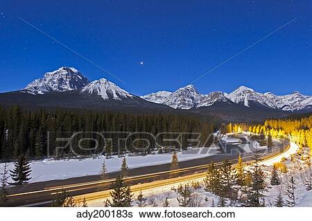A moonlit nightscape over the Bow River and Morant's Curve in Banff National Park, Canada. View Large Photo Image Stock Photograph - A moonlit nightscape over the Bow River and Morant's Curve in Banff National Park, Canada.. Fotosearch