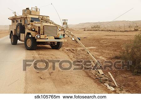 A MRAP vehicle disassembles an improvised explosive device. View Large Photo Image Picture - A MRAP vehicle disassembles an improvised explosive device.. Fotosearch