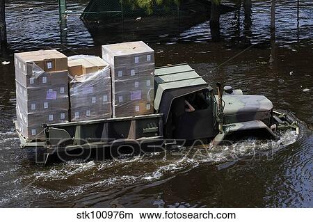 A National Guard M817 5-ton Dump Truck fords the floodwaters. View Large Photo Image Picture - A National Guard M817 5-ton Dump Truck fords the floodwaters.. Fotosearch