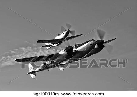 A P-38 Lightning and P-51D Mustang in flight. View Large Photo Image Picture - A P-38 Lightning and P-51D Mustang in flight.. Fotosearch