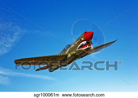 A P-40E Warhawk in flight. View Large Photo Image Picture - A P-40E Warhawk in flight.. Fotosearch