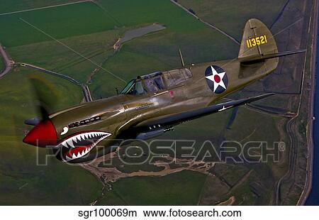 A P-40E Warhawk in flight. View Large Photo Image Picture - A P-40E Warhawk in flight.. Fotosearch