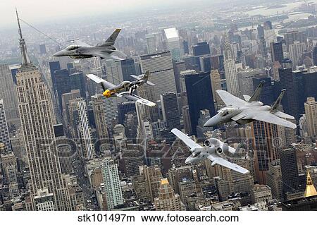 A P-51 Mustang, an F-16 Fighting Falcon, an F-15 Eagle, and an A-10 Thunderbolt II fly over New York City. View Large Photo Image Picture - A P-51 Mustang, an F-16 Fighting Falcon, an F-15 Eagle, and an A-10 Thunderbolt II fly over New York City.. Fotosearch