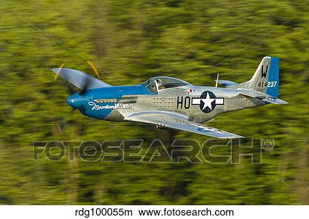 A P-51 Mustang flies along the Mississippi at Dubuque, Iowa. View Large Photo Image Picture - A P-51 Mustang flies along the Mississippi at Dubuque, Iowa.. Fotosearch