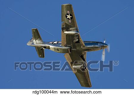 A P-51 Mustang flies by at Nellis Air Force Base, Nevada. View Large Photo Image Picture - A P-51 Mustang flies by at Nellis Air Force Base, Nevada.. Fotosearch