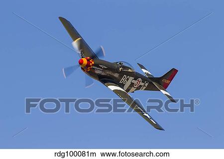 A P-51 Mustang flies by at Stead Field, Nevada. View Large Photo Image Picture - A P-51 Mustang flies by at Stead Field, Nevada.. Fotosearch