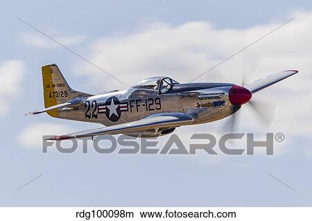 A P-51 Mustang flies by at Vacaville, California. View Large Photo Image Picture - A P-51 Mustang flies by at Vacaville, California.. Fotosearch