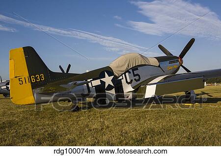A P-51 Mustang parked at EAA Airventure, Oshkosh, Wisconsin. View Large Photo Image Picture - A P-51 Mustang parked at EAA Airventure, Oshkosh, Wisconsin.. Fotosearch