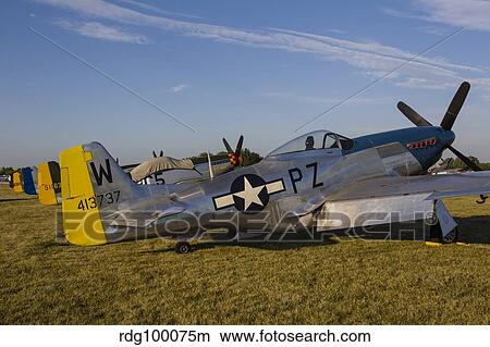 A P-51 Mustang parked at EAA Airventure, Oshkosh, Wisconsin. View Large Photo Image Picture - A P-51 Mustang parked at EAA Airventure, Oshkosh, Wisconsin.. Fotosearch