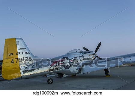A P-51 Mustang parked on the ramp at Livermore, California. View Large Photo Image Picture - A P-51 Mustang parked on the ramp at Livermore, California.. Fotosearch