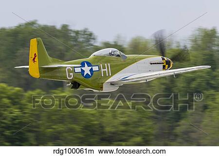 A P-51 Mustang takes off from Mount Comfort, Indiana. View Large Photo Image Picture - A P-51 Mustang takes off from Mount Comfort, Indiana.. Fotosearch