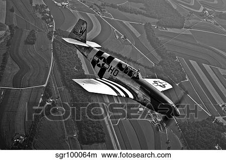 A P-51C Mustang in flight. View Large Photo Image Picture - A P-51C Mustang in flight.. Fotosearch