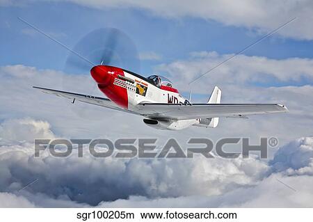 A P-51D Mustang in flight near Hollister, California. View Large Photo Image Picture - A P-51D Mustang in flight near Hollister, California.. Fotosearch