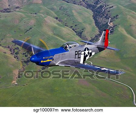 A P-51D Mustang in flight over Hollister, California. View Large Photo Image Picture - A P-51D Mustang in flight over Hollister, California.. Fotosearch