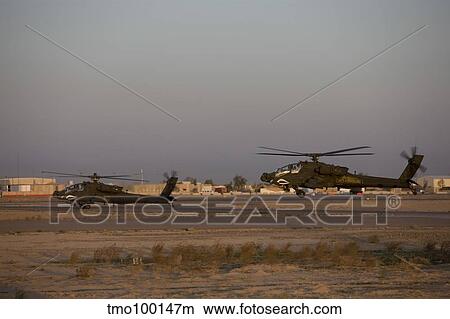 A pair AH-64D Apache Longbow Block III attack helicopters prepare for takeoff. View Large Photo Image Picture - A pair AH-64D Apache Longbow Block III attack helicopters prepare for takeoff.. Fotosearch