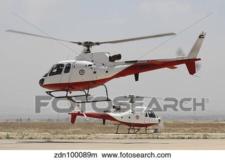 A pair of AS350 Squirrel helicopters of the Royal Jordanian Air Force. View Large Photo Image Picture - A pair of AS350 Squirrel helicopters of the Royal Jordanian Air Force.. Fotosearch