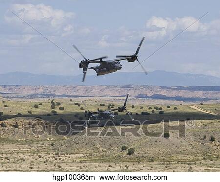 A pair of CV-22 Osprey's low level flying over New Mexico. View Large Photo Image Picture - A pair of CV-22 Osprey's low level flying over New Mexico.. Fotosearch