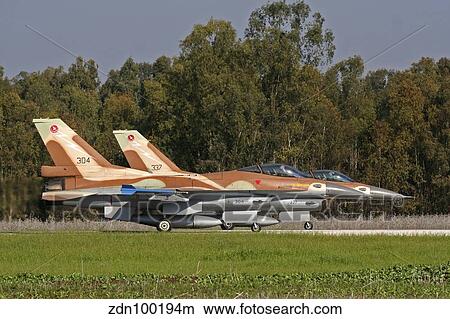 A pair of F-16C Barak of the Israeli Air Force on the runway. View Large Photo Image Picture - A pair of F-16C Barak of the Israeli Air Force on the runway.. Fotosearch