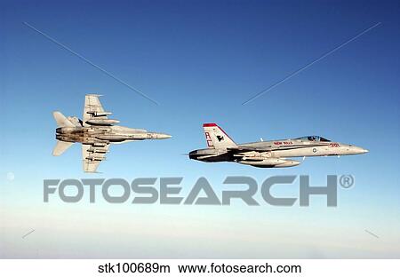 A pair of F/A-18C Hornets fly over Iraq. View Large Photo Image Picture - A pair of F/A-18C Hornets fly over Iraq.. Fotosearch