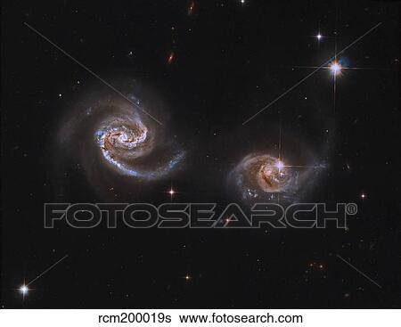 A pair of interacting spiral galaxies with swirling arms. View Large Photo Image Stock Photograph - A pair of interacting spiral galaxies with swirling arms.. Fotosearch
