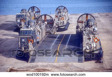 A pair of Navy landing craft air cushions rest on the old World War II seaplane ramps. View Large Photo Image Picture - A pair of Navy landing craft air cushions rest on the old World War II seaplane ramps.. Fotosearch