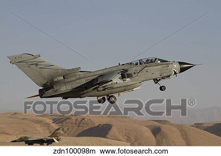 A Panavia Tornado of the Italian Air Force taking off. View Large Photo Image Picture - A Panavia Tornado of the Italian Air Force taking off.. Fotosearch