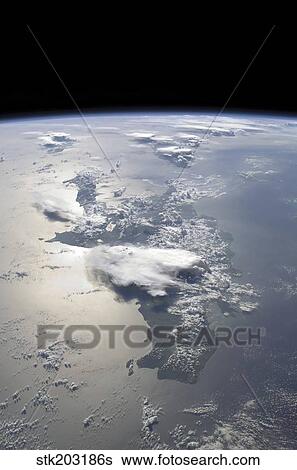 A panoramic view of the island of Hispaniola in the foreground and Cuba extending over the horizon. View Large Photo Image Stock Photograph - A panoramic view of the island of Hispaniola in the foreground and Cuba extending over the horizon.. Fotosearch
