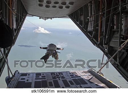 A pararescueman free falls from a HC-130P/N King refueling aircraft. View Large Photo Image Picture - A pararescueman free falls from a HC-130P/N King refueling aircraft.. Fotosearch