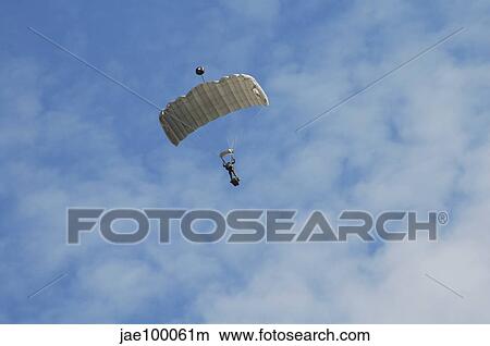A paratrooper of the Belgian Army in the air. View Large Photo Image Picture - A paratrooper of the Belgian Army in the air.. Fotosearch