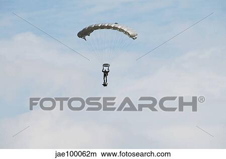 A paratrooper of the Belgian Army in the air. View Large Photo Image Picture - A paratrooper of the Belgian Army in the air.. Fotosearch