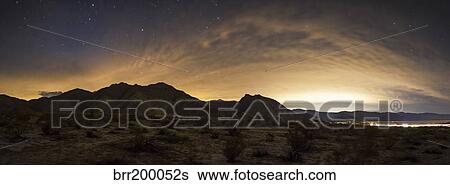 A partly coiudy sky over Borrego Springs, California. View Large Photo Image Stock Photograph - A partly coiudy sky over Borrego Springs, California.. Fotosearch