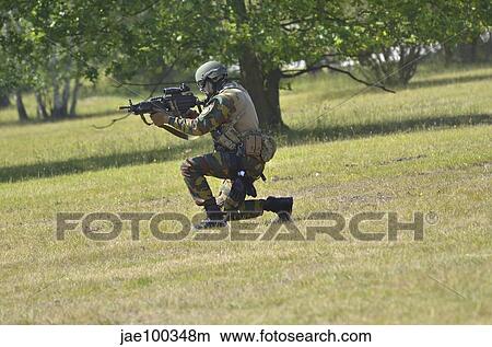 A pathfinder of the Belgian Army on guard in the feilds. View Large Photo Image Picture - A pathfinder of the Belgian Army on guard in the feilds.. Fotosearch