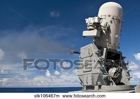 A Phalanx close-in weapons system is fired aboard USS Cowpens. View Large Photo Image Picture - A Phalanx close-in weapons system is fired aboard USS Cowpens.. Fotosearch