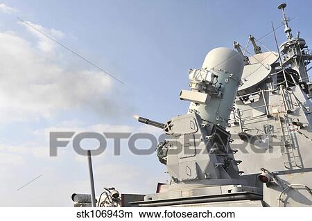 A phalanx close-in weapons system is fired aboard USS Lassen. View Large Photo Image Picture - A phalanx close-in weapons system is fired aboard USS Lassen.. Fotosearch