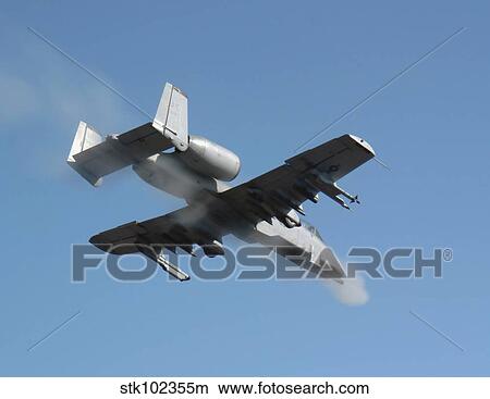 A Pilot fires the GAU-8 from an A-10 Thunderbolt II. View Large Photo Image Picture - A Pilot fires the GAU-8 from an A-10 Thunderbolt II.. Fotosearch