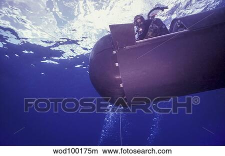 A pilot guides a SEAL Delivery Vehicle to a tether line. View Large Photo Image Picture - A pilot guides a SEAL Delivery Vehicle to a tether line.. Fotosearch